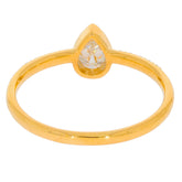 Pear-shaped white diamond ring in gold setting, showcasing elegance and sophistication in jewelry design.